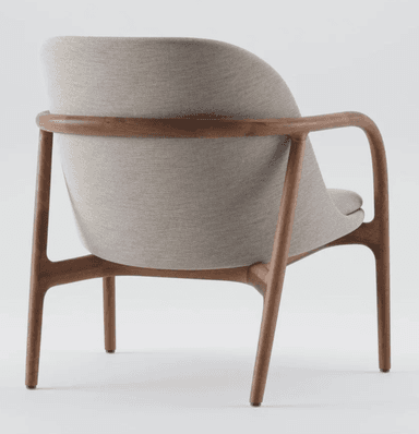 A contemporary lounge chair featuring a gracefully curved solid wood frame, likely walnut, that forms the legs, armrests, and back support in a continuous, flowing line. The seat and backrest are upholstered in a light beige or light gray textured fabric, nestled within the wooden structure. The design emphasizes organic forms and ergonomic comfort. — 3D model