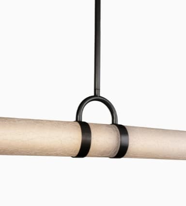 A contemporary linear pendant light featuring a long, horizontal tubular diffuser suspended by a dark metal rod and decorative bands, designed for overhead illumination. — 3D model