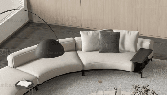 A modern, modular curved sectional sofa upholstered in light off-white fabric. The sofa features a sweeping curved form, composed of multiple sections including a chaise lounge element at one end. It is supported by a slender, minimalist black metal frame that extends to small, discreet legs. An integrated dark-colored side table or console is positioned at the opposite end of the sofa, providing a functional surface. The seating is complemented by loose back cushions in matching off-white, along with a contrasting dark grey throw pillow. — 3D model