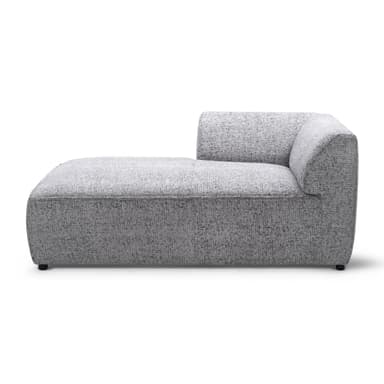 A modern, modular sofa section designed as a left-arm facing chaise lounge or corner piece. It features a low profile, blocky base, and a wrap-around back and armrest that curves gently on the left side. The upholstery is a textured, speckled fabric. — 3D model