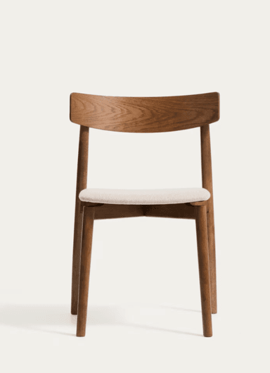A modern dining chair featuring a solid wood frame with a curved wooden backrest and an upholstered seat. The chair exhibits clean lines and a minimalist design. — 3D model