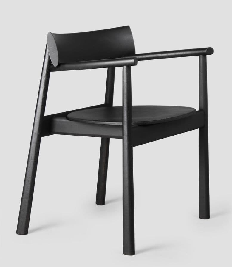 A black armchair with a minimalist design, featuring a curved backrest and a circular seat. The frame is constructed from dark wood, with slender legs and armrests. The backrest has a rounded cap on its upper edge. — 3D model