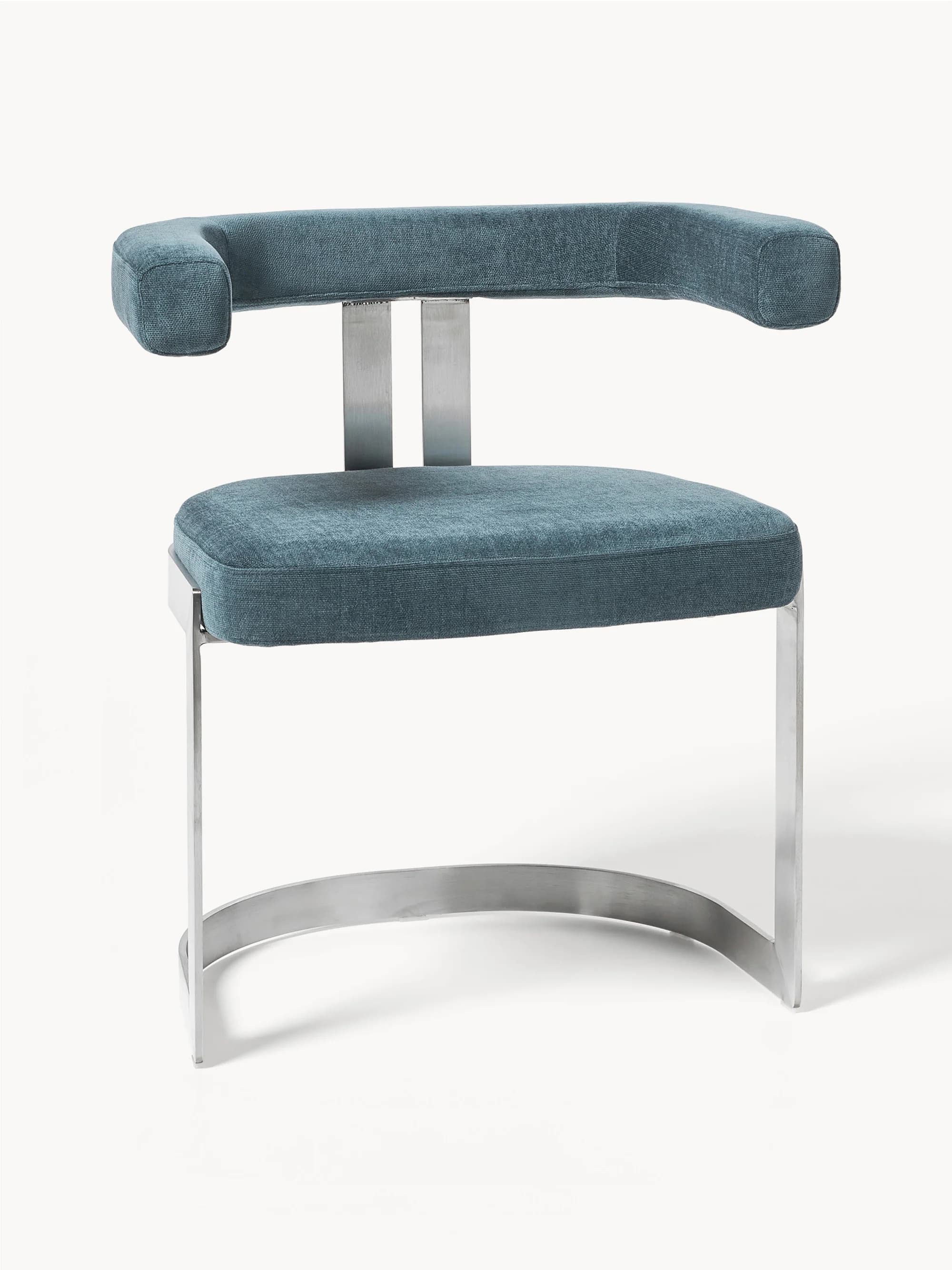 A modern armchair with a metal frame and upholstered seating. The armchair features a curved, open armrest design, a rectangular seat cushion, and a curved sled base. The frame appears to be made of polished metal, possibly stainless steel or aluminum, with a brushed finish. The upholstery is a textured fabric in a deep teal or blue-green hue. — 3D model