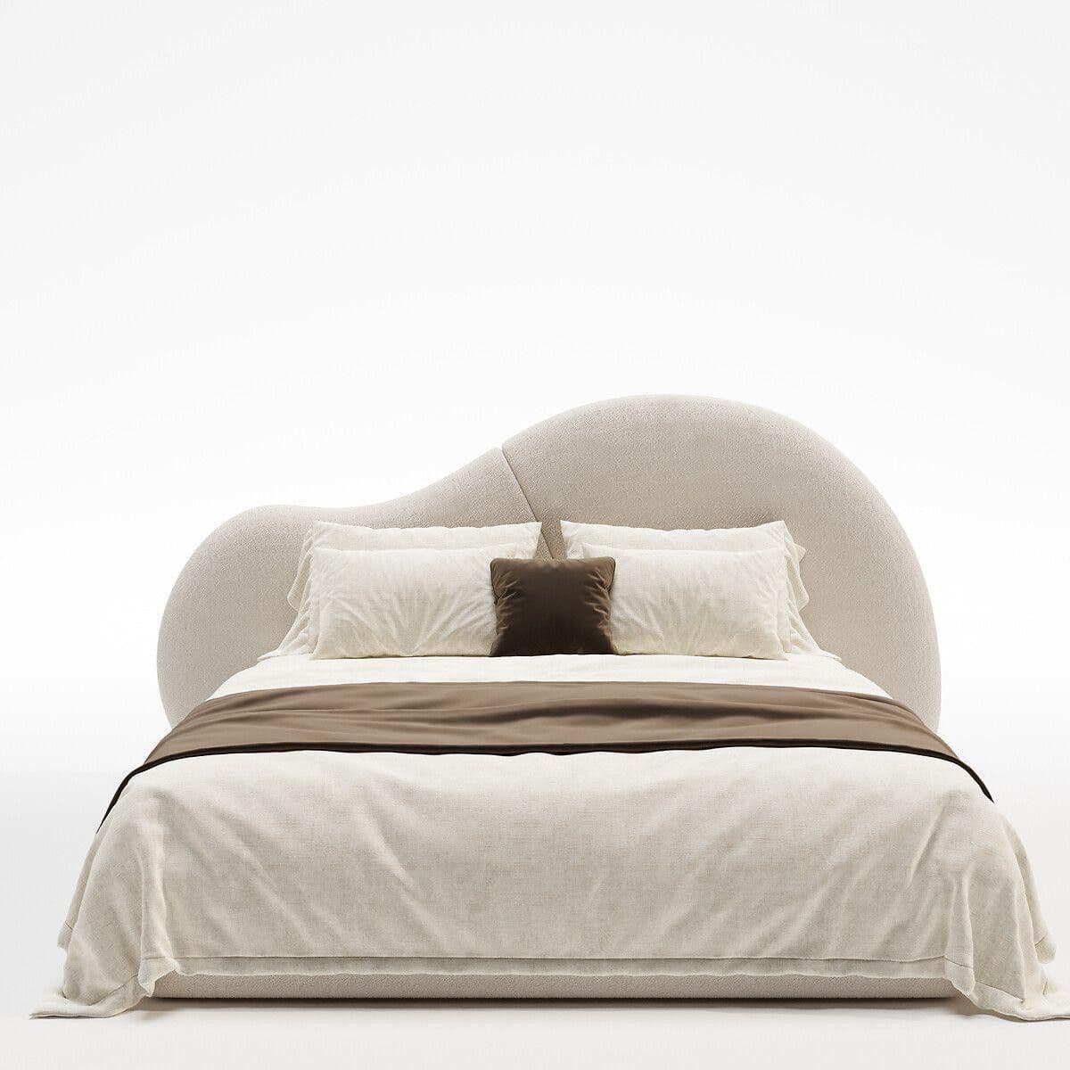 An upholstered platform bed featuring a unique, irregularly shaped headboard with soft, undulating curves. The entire frame is covered in a light beige, textured fabric, possibly boucle, and dressed with light-colored bedding and a dark brown accent pillow and throw. — 3D model