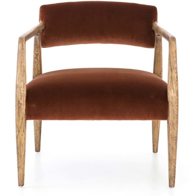 An armchair featuring a solid wood frame with curved armrests and upholstered seat and back in a rust-colored velvet fabric. The wooden frame exhibits a prominent grain, suggesting oak or a similar light-colored wood, and includes four tapered legs. The design combines mid-century modern aesthetics with contemporary comfort. — 3D model