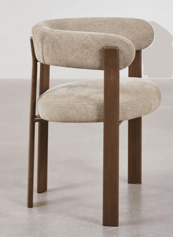 A contemporary accent chair with a curved backrest and seat, upholstered in a textured, light-colored fabric. The chair features a distinctive frame constructed from dark wood, with four legs providing support. The arms are integrated into the backrest structure. — 3D model
