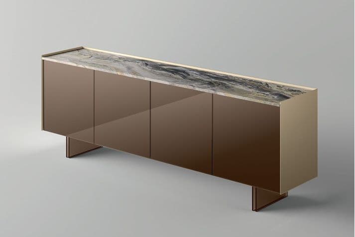 A contemporary sideboard with a long, rectangular form. It features a marble top with a distinctive veined pattern and a metallic edge trim. The body of the sideboard has a high-gloss, reflective finish with four doors, suggesting ample internal storage. The base is comprised of two distinct, angular legs that provide a modern aesthetic. — 3D model