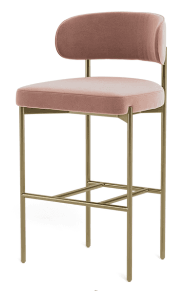 A modern bar stool featuring a rounded upholstered backrest and a padded seat cushion, both covered in a dusty rose velvet fabric. The frame is constructed from slender, tubular metal with a golden or brass finish, incorporating an integrated rectangular footrest. The design is sleek and minimalist, suitable for contemporary interiors. — 3D model