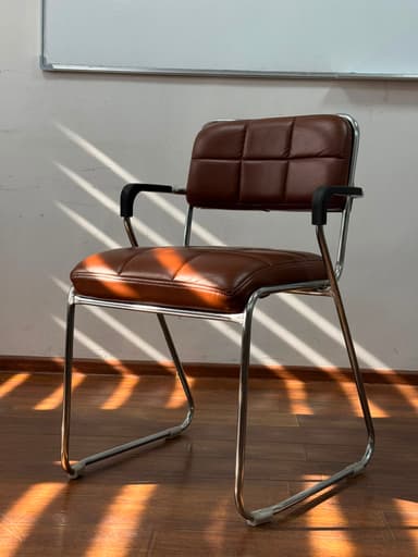 A mid-century modern style armchair featuring a polished chrome sled-base frame and brown quilted faux leather upholstery on the seat and backrest. — 3D model