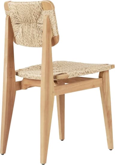 A dining chair featuring a light natural wood frame and a seat and backrest meticulously hand-woven from natural fiber, with subtly splayed legs. — 3D model