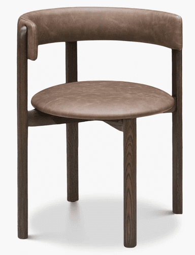 A contemporary armchair featuring a dark-stained solid wood frame and a curved backrest and round seat upholstered in brown leather. — 3D model
