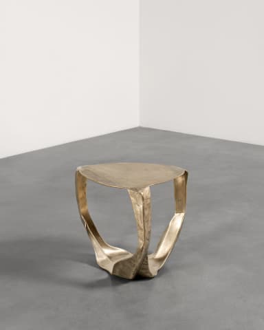 A sculptural accent table crafted from brass with an organic, fluid form. The table features a rounded triangular top and a base composed of three sinuous, interconnected legs that converge towards the ground, creating a dynamic and artistic silhouette. The brass exhibits an antiqued or distressed finish, enhancing its visual texture and depth. — 3D model