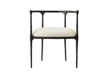 An armchair featuring a dark, heavily textured, and organically shaped cast metal frame paired with a light-colored, upholstered seat cushion. — 3D model