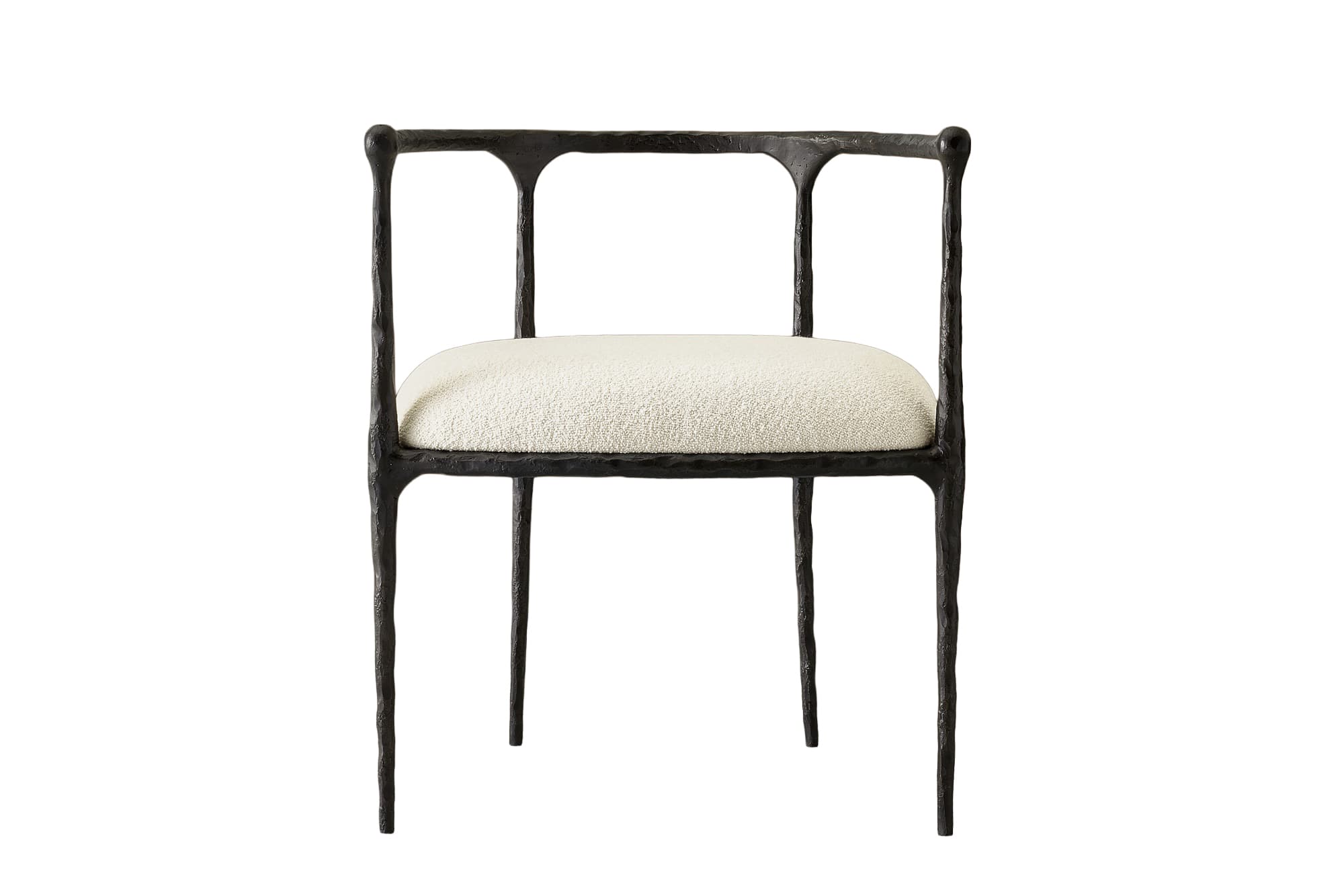 An armchair featuring a dark, heavily textured, and organically shaped cast metal frame paired with a light-colored, upholstered seat cushion. — 3D model