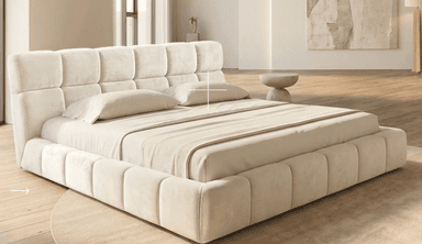 A contemporary upholstered platform bed featuring a distinctive grid-tufted headboard and frame in a soft, light-colored fabric. The low-profile design includes a mattress and bedding in coordinating neutral tones. — 3D model
