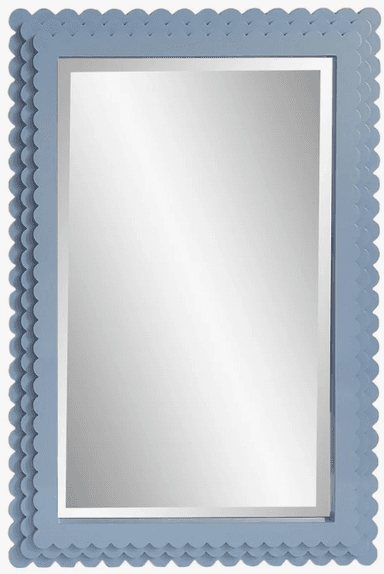 A rectangular wall mirror featuring a thick, light blue frame with a distinctive scalloped or bobble-like textured edge. The mirror is presented at an angle, highlighting the depth and decorative detail of its frame. — 3D model