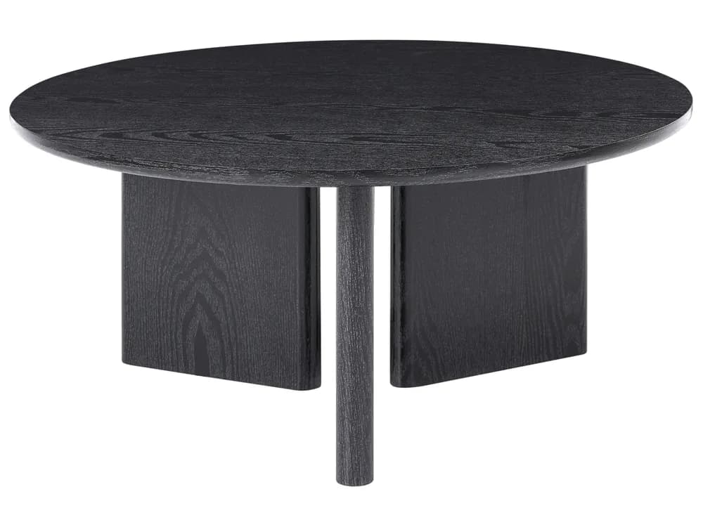 An oval-shaped coffee table with a modern minimalist design, featuring a black stained wood finish that highlights the natural grain. The tabletop is supported by a distinctive three-part base, comprising two flat, rectangular panels and a single cylindrical leg, all rendered in the same black wood. — 3D model