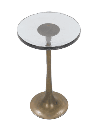 A tall, slender accent table featuring a round, textured glass top supported by a single, tapering metal pedestal base with a trumpet-shaped foot. The metal base has a muted, antiqued brass or bronze finish. The glass top appears to have an organic, rippled texture. — 3D model