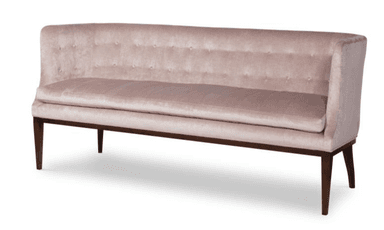 A blush pink tufted velvet banquette bench with a high back and dark wooden tapered legs. — 3D model