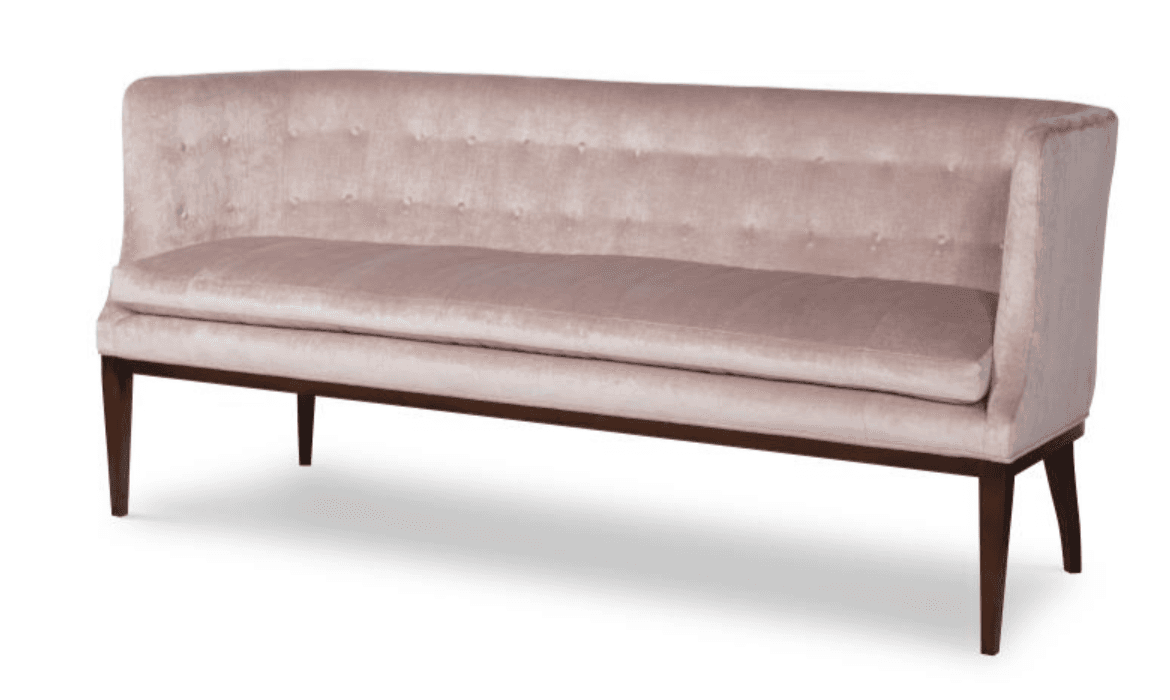 A blush pink tufted velvet banquette bench with a high back and dark wooden tapered legs. — 3D model