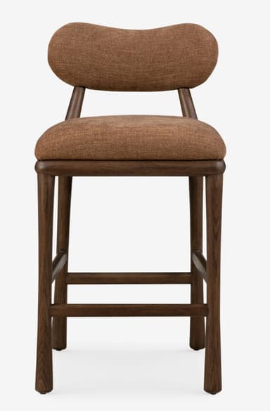 A contemporary bar stool featuring a dark stained wooden frame and upholstered seat and backrest. The backrest is distinctly curved and organic in shape, providing lumbar support. The seat is generously padded and rounded. The frame consists of four sturdy, tapered legs connected by integrated footrests for comfort and stability. The upholstery is a textured, rust-brown fabric, complementing the dark wood finish. — 3D model