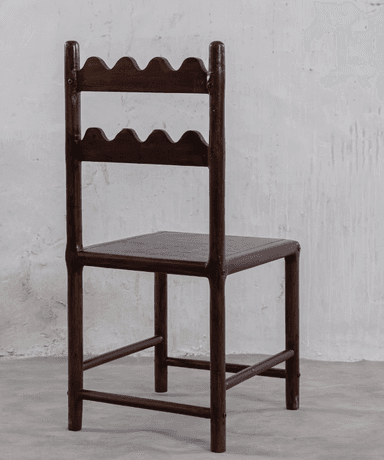 A dark-stained wooden chair featuring a distinctive backrest with two horizontal slats, each carved with a wavy or scalloped edge. It has a simple square wooden seat and straight legs with stretchers. — 3D model