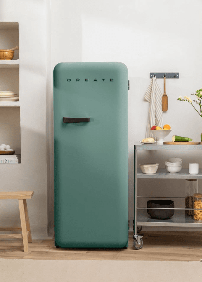 A freestanding refrigerator with a minimalist design. The refrigerator is vertically oriented and features a single door. The surface appears smooth and uniformly colored. A small, rectangular handle is located near the center of the door. The word "CREATE" is subtly printed near the top of the door. — 3D model