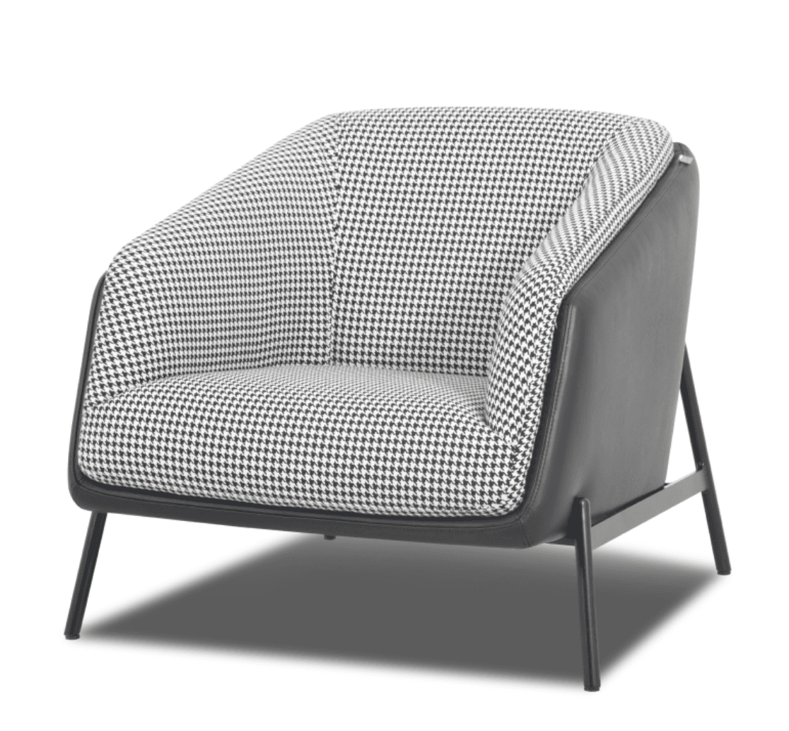 A contemporary lounge chair featuring a distinctive barrel-back design. The interior upholstery showcases a black and white houndstooth pattern, while the exterior of the chair and its armrests are finished in a solid dark material, likely faux leather. The chair is supported by a slender, open black metal frame that forms the legs. — 3D model