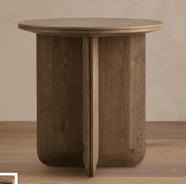A wooden end table with a circular top and a cylindrical base supported by two intersecting vertical panels. The table has a natural wood finish. — 3D model