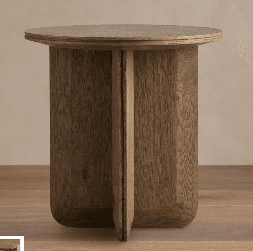A wooden end table with a circular top and a cylindrical base supported by two intersecting vertical panels. The table has a natural wood finish. — 3D model