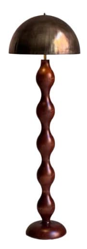 A floor lamp with a dark, dome-shaped lampshade and a decorative, segmented wooden pole. The pole features a series of vertically stacked, bulbous forms. The base is round and flat. The overall aesthetic suggests a mid-century or contemporary design. — 3D model