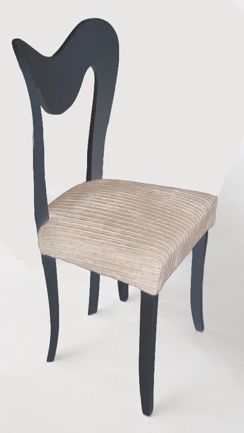 A dark-colored chair with a distinctly shaped backrest and a cushioned seat upholstered in a light-colored, ribbed fabric. The legs and frame appear to be made of wood, painted a dark, matte finish. The seat has a slightly rounded front and is generously padded. The backrest has a unique, flowing silhouette with a cut-out section. — 3D model