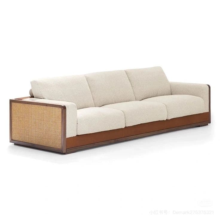 A contemporary three-seater sofa featuring a dark wood frame, light-colored textured fabric upholstery, cane webbing panels on the armrests, and a tan leather trim along the base. — 3D model