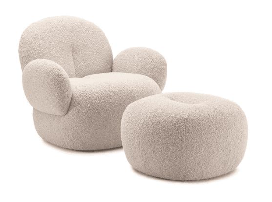 A plush, cream-colored armchair with a rounded, organic design, featuring a high, curved back and generous, rounded armrests. It is upholstered in a textured boucle fabric. A matching ottoman with a similar rounded form and boucle upholstery is positioned in front of the armchair. — 3D model