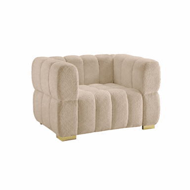 A plush, cream-colored armchair with a distinctive channel-tufted design. The upholstery has a textured, boucle-like finish. The chair features rounded armrests and a deep seat. It is supported by two low-profile, rectangular brass feet. — 3D model
