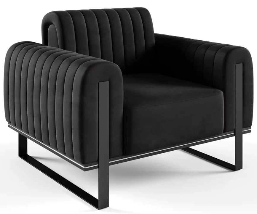 A contemporary armchair featuring a channel-tufted black velvet upholstery on its back and arms, contrasted with a sleek, open black metal frame. The seat cushion is plain black velvet. A silver-colored trim detail is visible along the base of the upholstered body, connecting to the metal frame. — 3D model