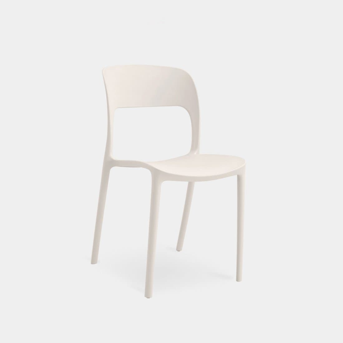 A modern, single-piece molded plastic chair with a curved seat and backrest. The backrest features an open rectangular cutout. It has four slender, angled legs that taper slightly towards the bottom. The chair's design is minimalist and appears to be suitable for indoor or outdoor use. — 3D model