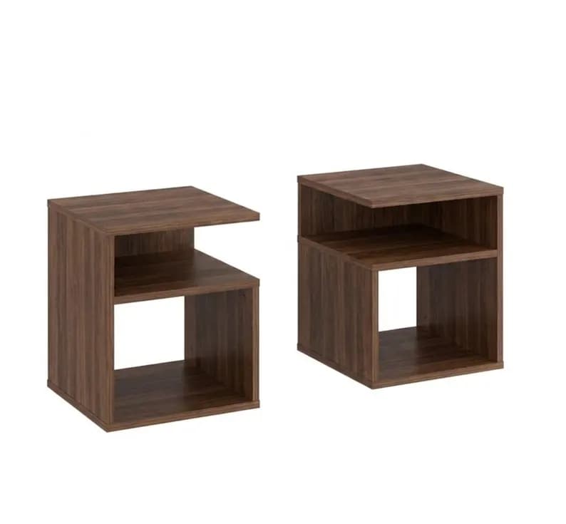 Two identical dark brown cube-shaped side tables, each featuring an open design with two internal shelves. The top shelf is offset, creating an L-shaped opening at the front, while the bottom section forms a simple open cube. The tables have a wood grain laminate finish. — 3D model