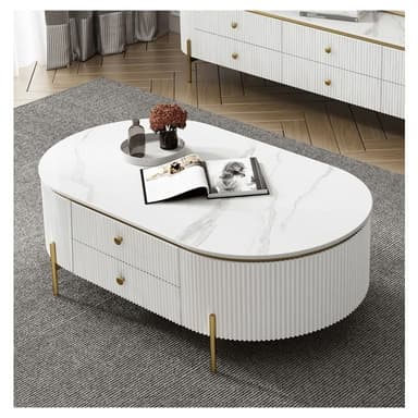 An oval-shaped coffee table featuring a white marble top with grey veining, complemented by a white fluted body. The table includes two integrated drawers with small round brass pull handles. A thin brass trim outlines the marble top, and the table stands on four slender, tapered brass legs, contributing to a modern glam aesthetic. — 3D model