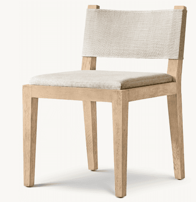A contemporary dining chair featuring a light-colored wooden frame and upholstered seat and backrest. The frame consists of straight, slightly tapered square legs and a minimalist structure. The seat is a rectangular upholstered cushion, and the backrest is formed by a wide, taut fabric strap attached to the uprights of the frame. The fabric appears to be a textured, light beige or cream color, complementing the natural tone of the wood. — 3D model