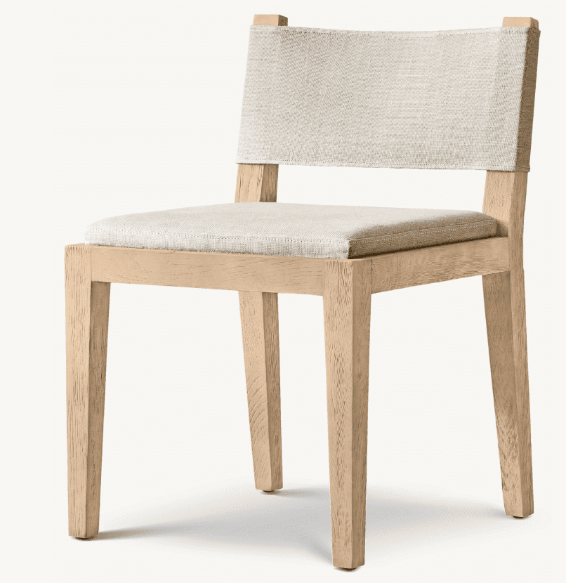 A contemporary dining chair featuring a light-colored wooden frame and upholstered seat and backrest. The frame consists of straight, slightly tapered square legs and a minimalist structure. The seat is a rectangular upholstered cushion, and the backrest is formed by a wide, taut fabric strap attached to the uprights of the frame. The fabric appears to be a textured, light beige or cream color, complementing the natural tone of the wood. — 3D model