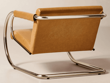 A modernist lounge chair featuring a cantilever tubular chrome frame and camel-colored leather upholstery. The frame forms continuous, polished curves for the base and armrests, which are padded with rolled leather sleeves. It has separate box cushions for the seat and back. — 3D model