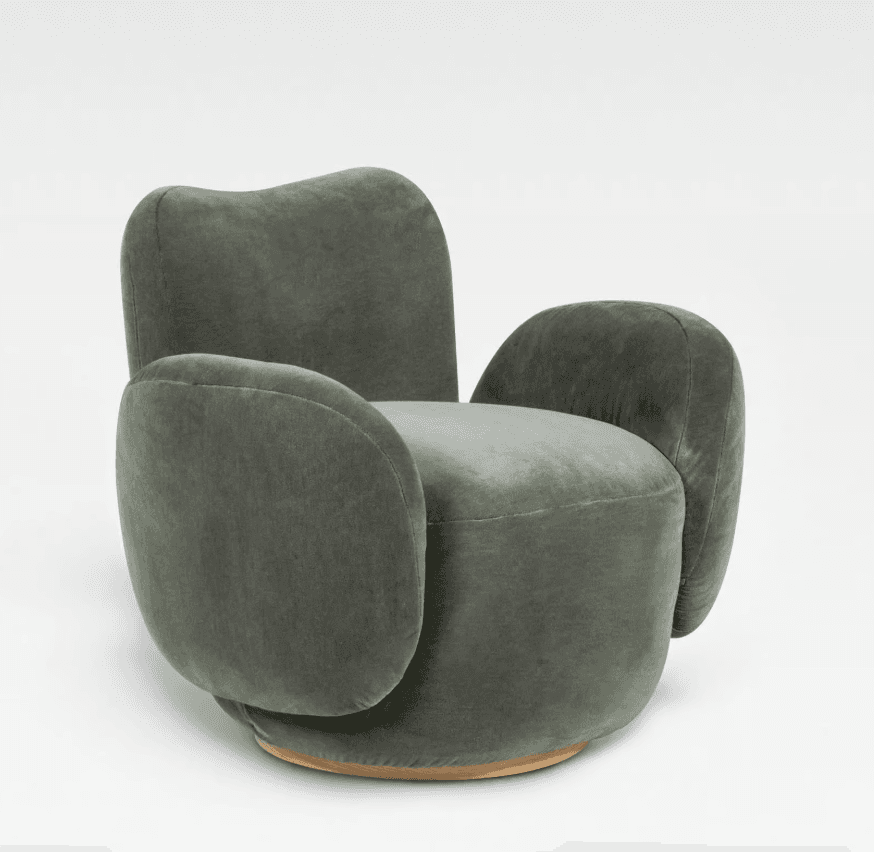A contemporary upholstered swivel lounge chair in a muted green velvet or velour fabric. The chair features a soft, organic silhouette with generously padded, rounded armrests that seamlessly flow into the body. The backrest is gently curved, and the entire piece sits on a discreet, circular wooden swivel base. — 3D model