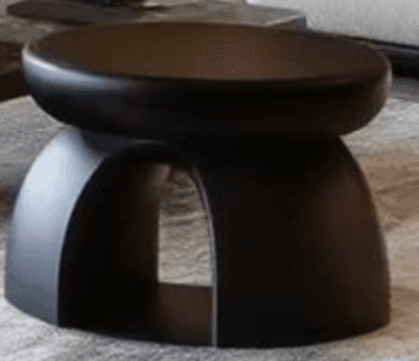 A minimalist, matte black stool with a round top and a curved, arched base. — 3D model
