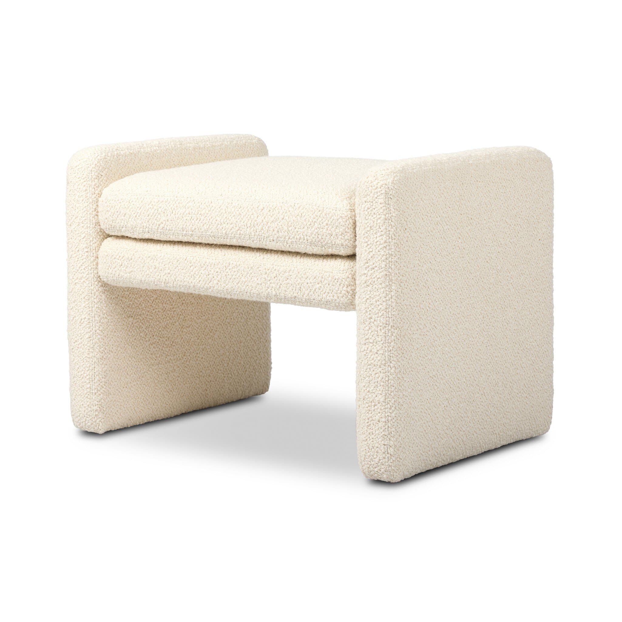 A low-profile, rectangular ottoman upholstered in a textured boucle fabric. It features a minimalist design with a U-shaped frame on each side supporting a double-cushioned seat. — 3D model