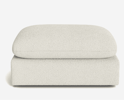 An off-white, boucle upholstered ottoman featuring a two-tiered design with a rectangular base and a plush, rounded-edge cushion. The fabric has a textured, looped appearance, and the overall design is contemporary and minimalist. — 3D model