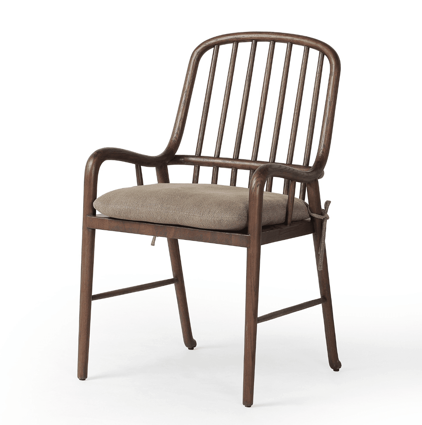 A wooden armchair with a curved backrest composed of vertical spindles. It features rounded armrests and a cushioned seat. The frame is constructed from dark wood, and the cushion is upholstered in a neutral-toned fabric. — 3D model