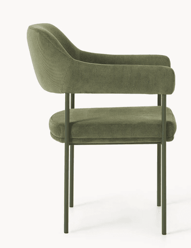 A modern armchair with a gently curved backrest and armrests. The upholstery features a corduroy texture. The frame consists of slender, dark green metal legs. — 3D model