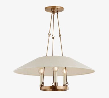 A modern chandelier featuring a wide, shallow, inverted dome-shaped lampshade made of light gray fabric. Beneath the fabric shade, a polished brass ring holds three vertically oriented light sockets, each fitted with a candle-style LED bulb. The fixture is suspended by thin brass rods, contributing to its minimalist and elegant aesthetic. The light emitted by the bulbs is diffused by the fabric shade, creating a soft, ambient glow. — 3D model
