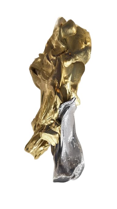 An abstract, modern sculpture featuring an organic, flowing form. It is composed of two distinct metallic elements: an upper section with a rich, textured gold finish and a lower section with a contrasting silver finish. The surface exhibits a highly textured, almost molten or draped quality, creating visual depth and movement. The sculpture stands upright on a subtle base, showcasing a dynamic interplay between its two-tone metallic surfaces. — 3D model